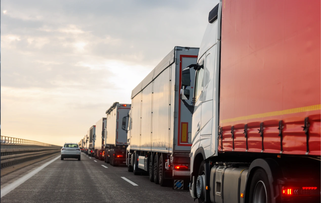 Delayed cross-border shipment truck at international customs checkpoint